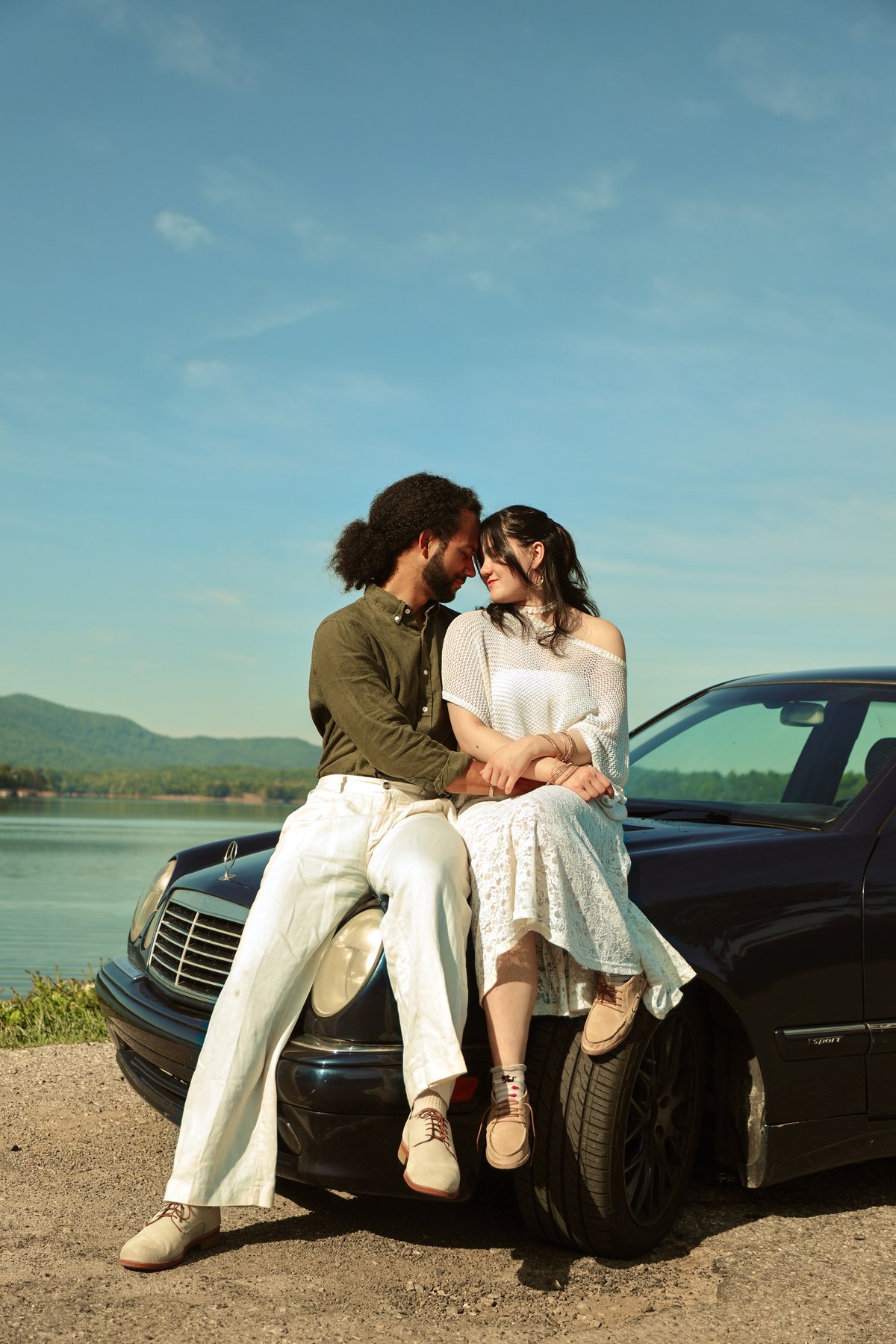 Couples photography beside a car